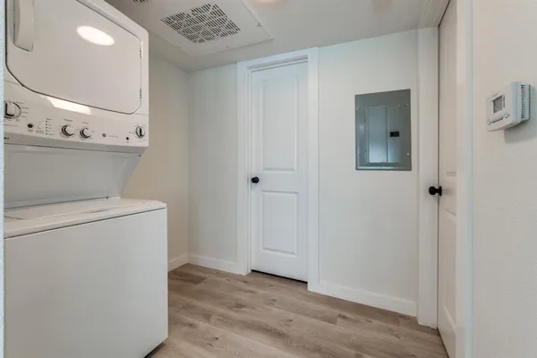 a view of a hallway with washer and dryer