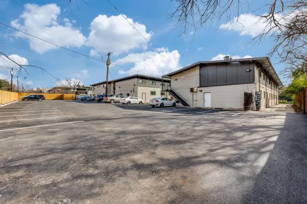 a view of a car park in front of house