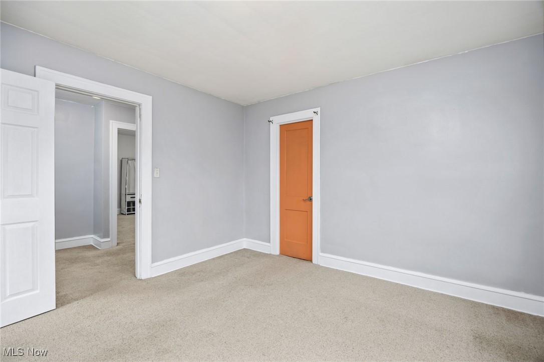 3368 Berea Road Cleveland, OH 44111 - Photo 11 of 26 Empty room with carpet and baseboards