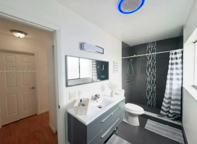 a bathroom with a toilet and a bathtub