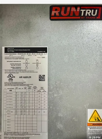 a outdoor space with lots of glass windows and glass door