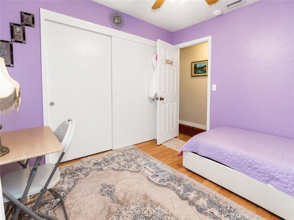 4100 Ahwahnee Court Modesto, CA 95356 - Photo 25 of 34 Cozy bedroom with closet storage and flexible space for a desk or vanity.