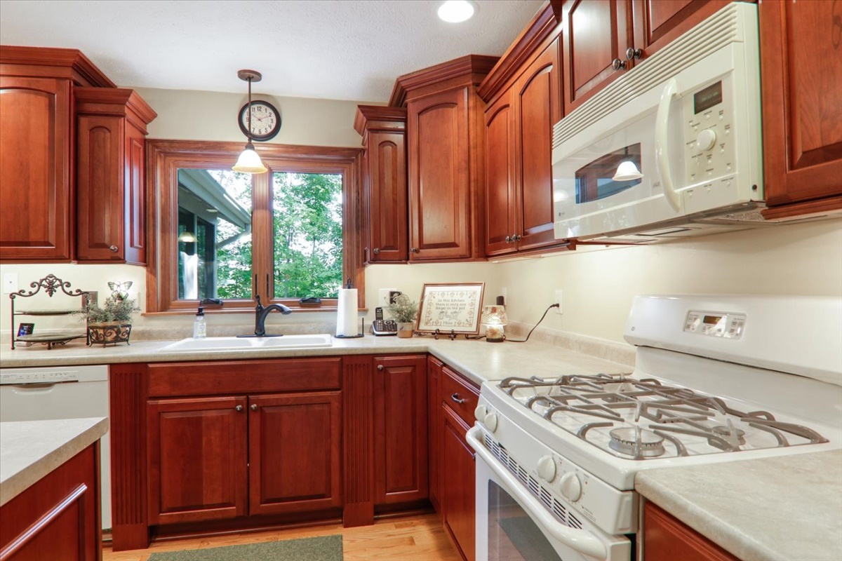 21 Bent Tree Lane Towanda, IL 61776 - Photo 15 of 49 a kitchen with a stove a sink and a cabinets