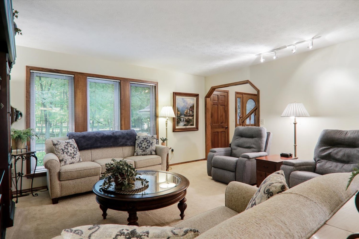 21 Bent Tree Lane Towanda, IL 61776 - Photo 19 of 49 a living room with furniture and a large window