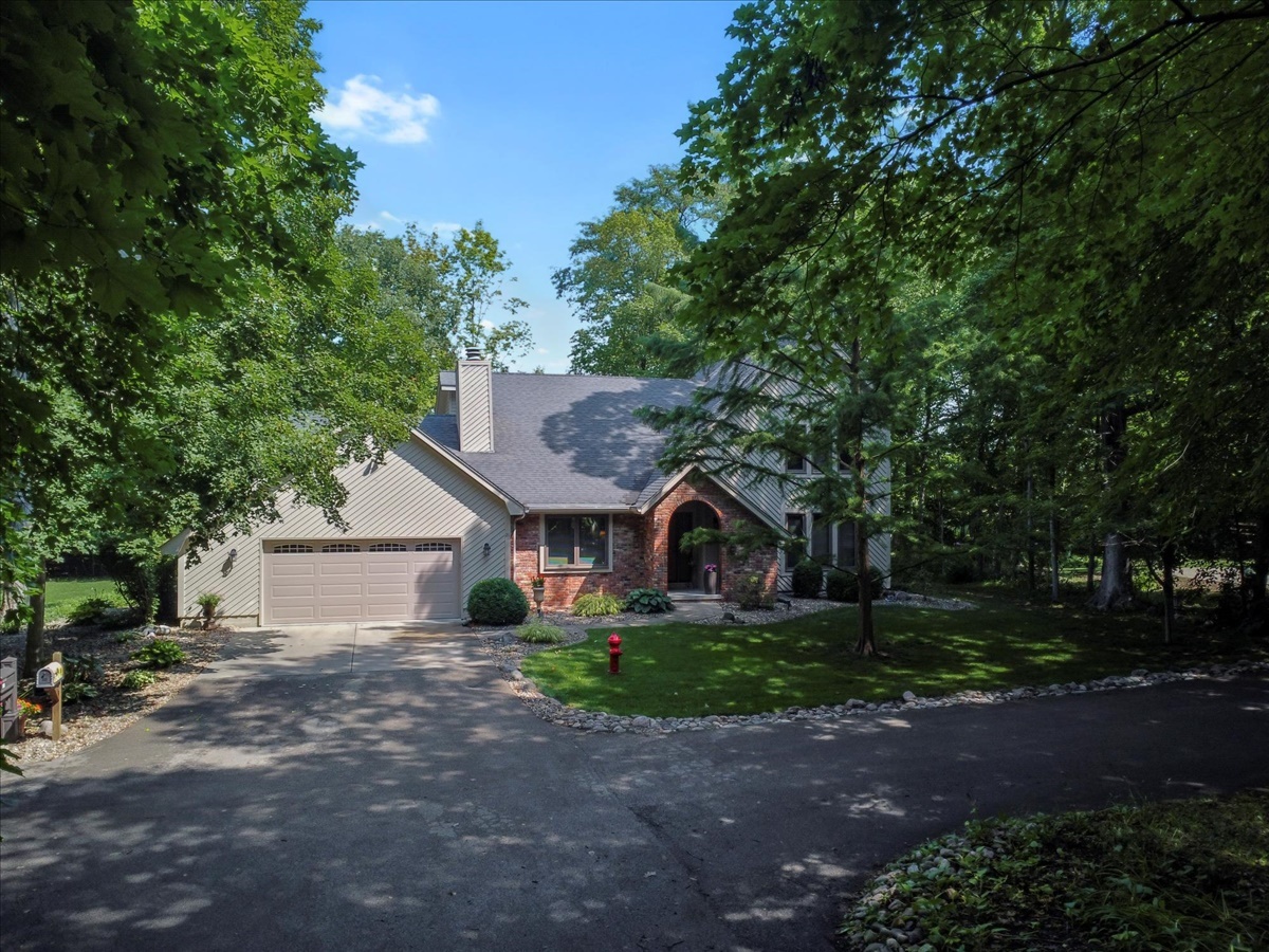 21 Bent Tree Lane Towanda, IL 61776 - Photo 2 of 49 a front view of a house with garden