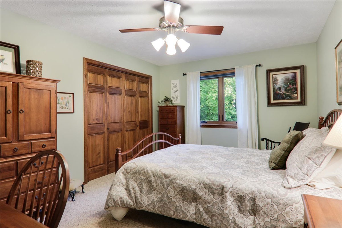 21 Bent Tree Lane Towanda, IL 61776 - Photo 21 of 49 a bedroom with a bed and dresser with mirror