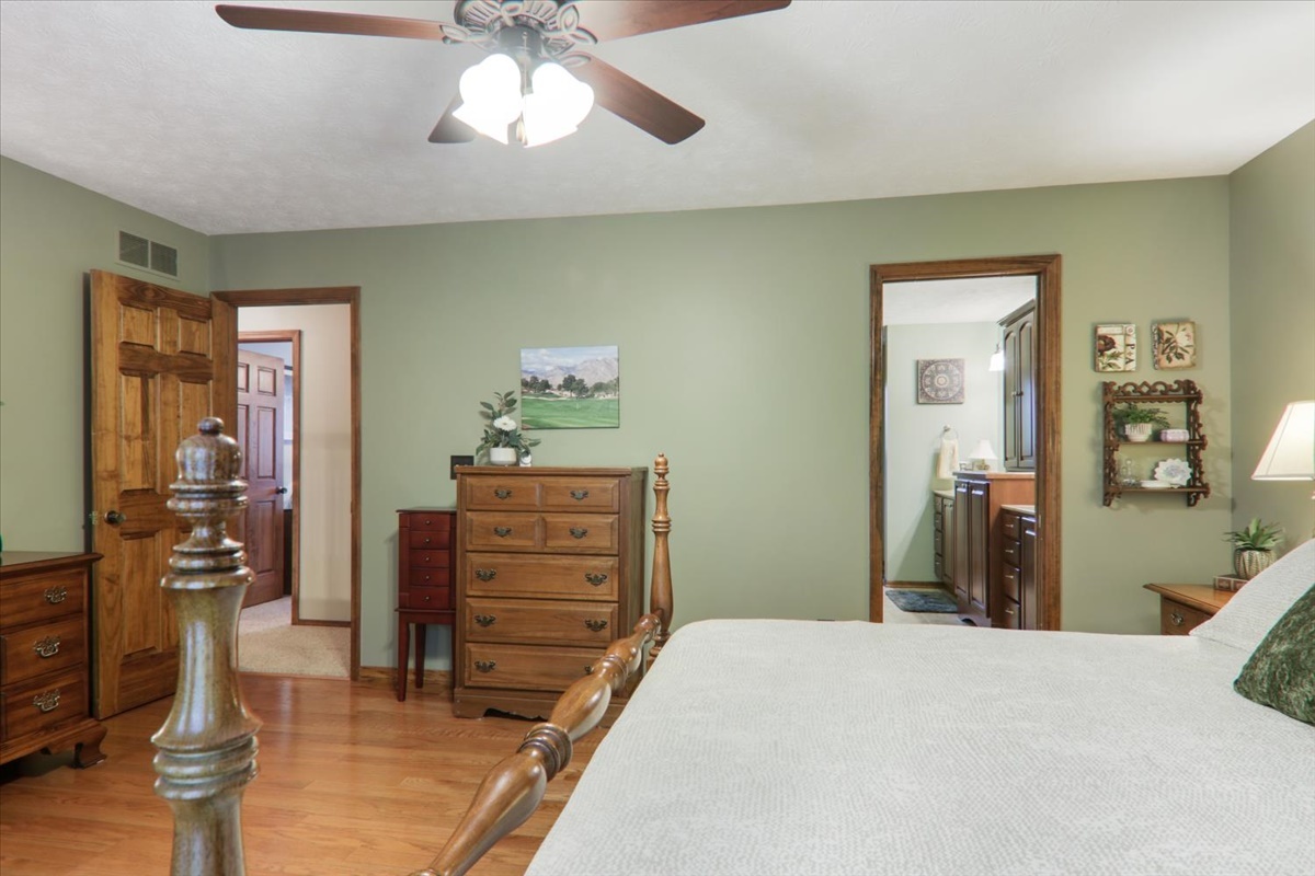 21 Bent Tree Lane Towanda, IL 61776 - Photo 26 of 49 a bedroom with a bed and wooden floor