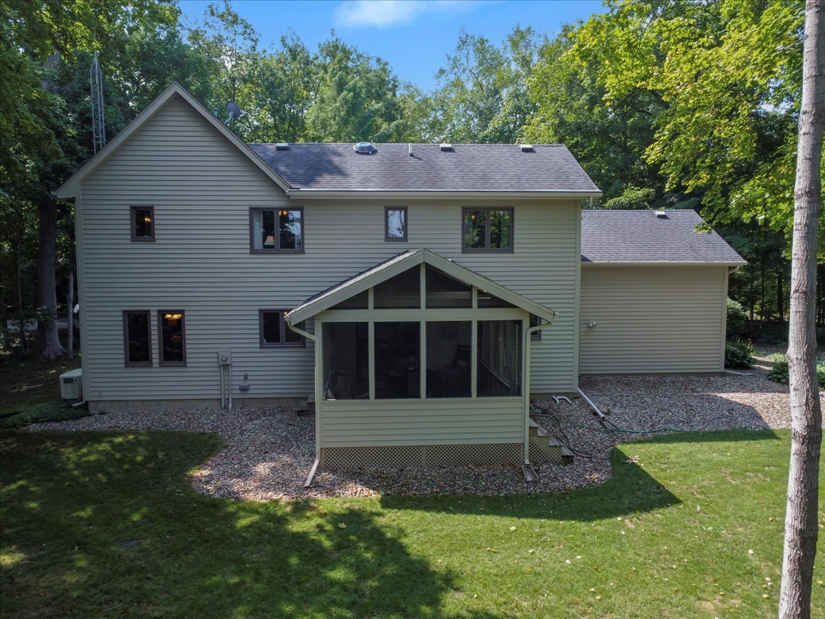 21 Bent Tree Lane Towanda, IL 61776 - Photo 39 of 49 a view of a yard in front of a house with plants and large tree