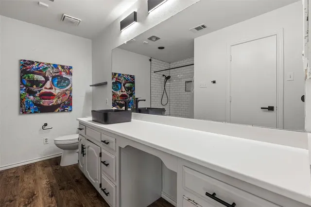 a bathroom with a sink a vanity and a mirror