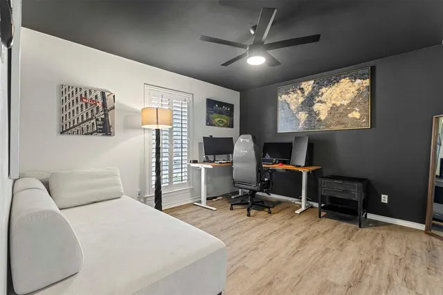 a bedroom with furniture and a flat screen tv