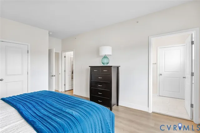 a bedroom with a bed and a dresser