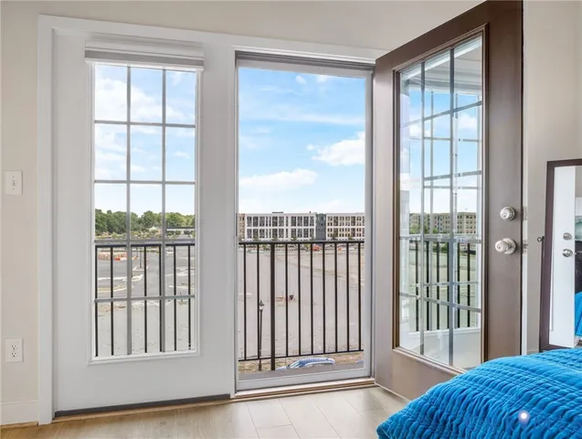 a view of a glass door with a balcony