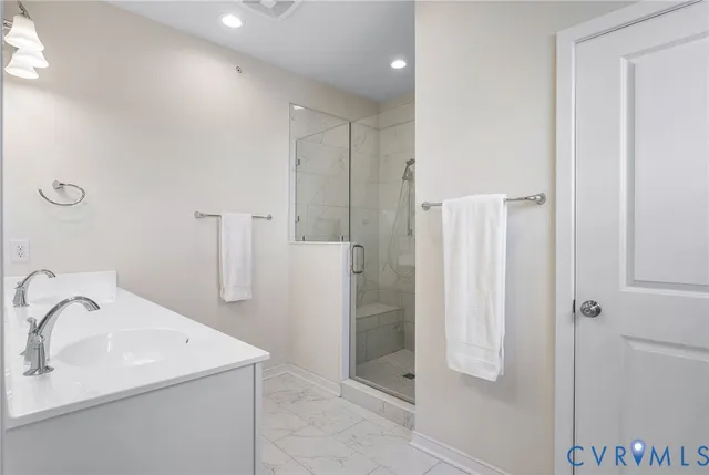 a bathroom with a sink and a shower