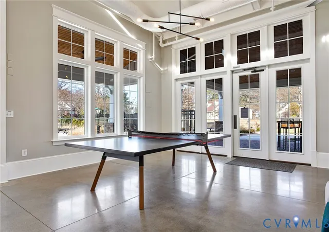 a view of balcony with a large window and wooden floor
