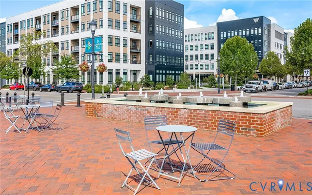 a view of a swimming pool with outdoor seating