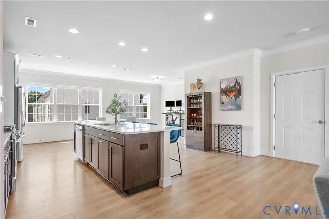 a kitchen with stainless steel appliances granite countertop a stove and a refrigerator