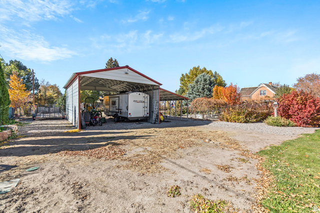 390 North 100 West Monroe, UT 84754 - Photo 35 of 167 View of car parking with dirt driveway and a carport