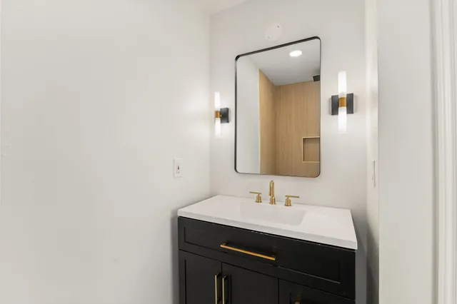 a bathroom with a sink and a mirror