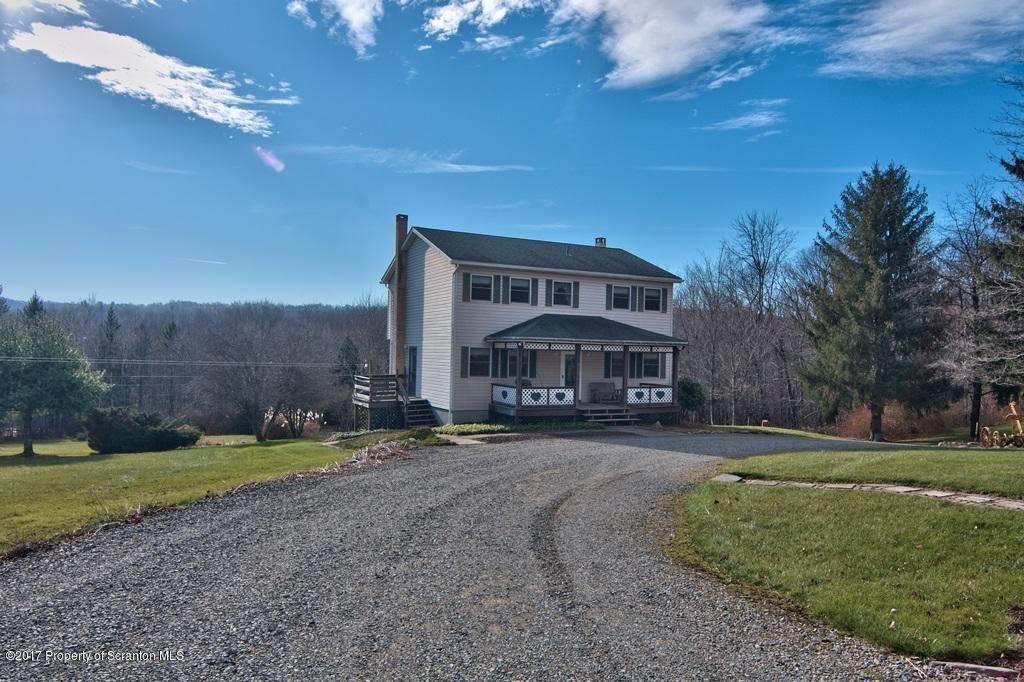 132 Thomas Road Moscow, PA 18444 - Photo 1 of 46 a view of a house with a big yard