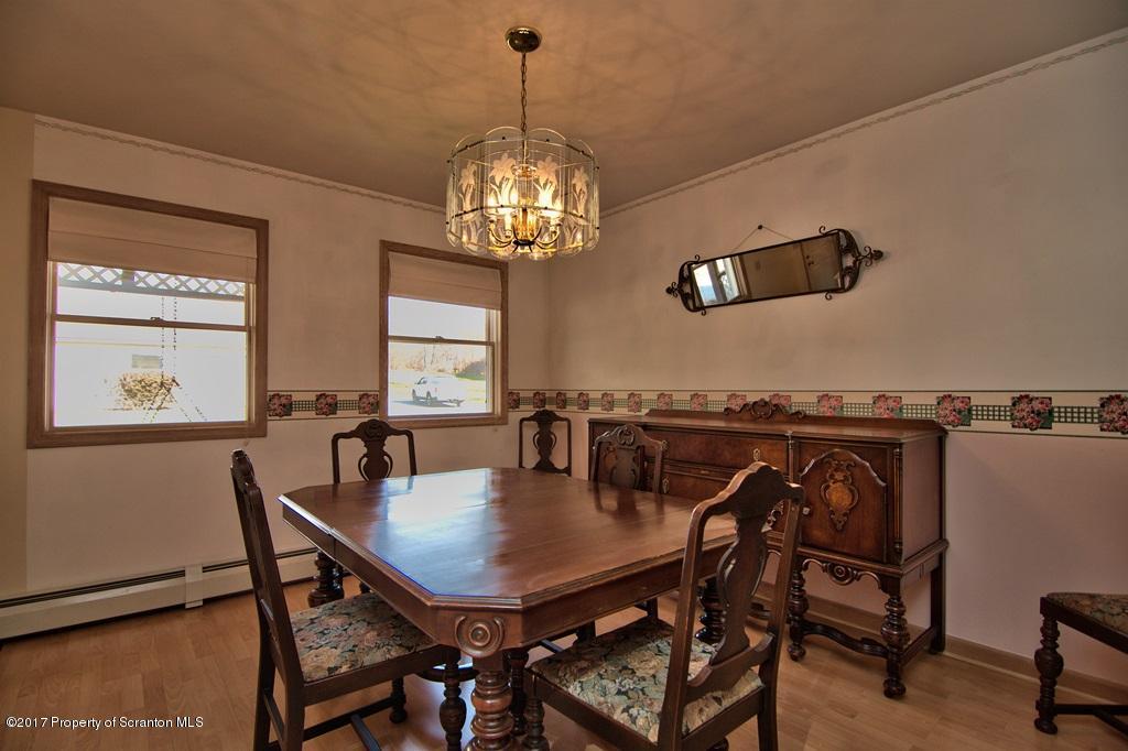 132 Thomas Road Moscow, PA 18444 - Photo 11 of 46 a view of a dining room with furniture and chandelier