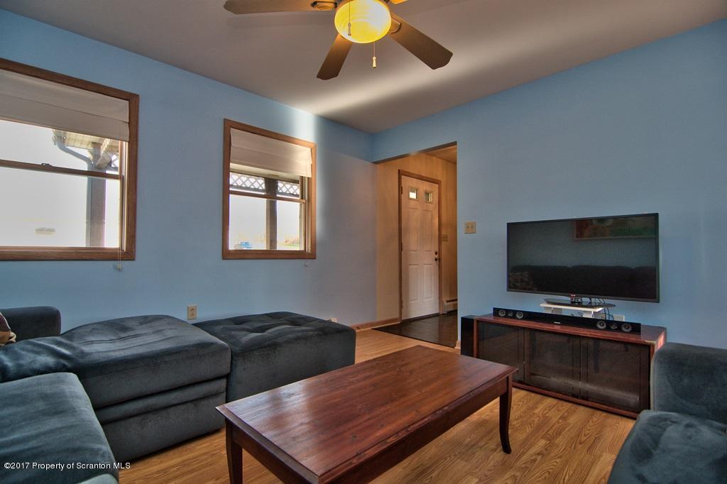 132 Thomas Road Moscow, PA 18444 - Photo 13 of 46 a living room with furniture and a flat screen tv