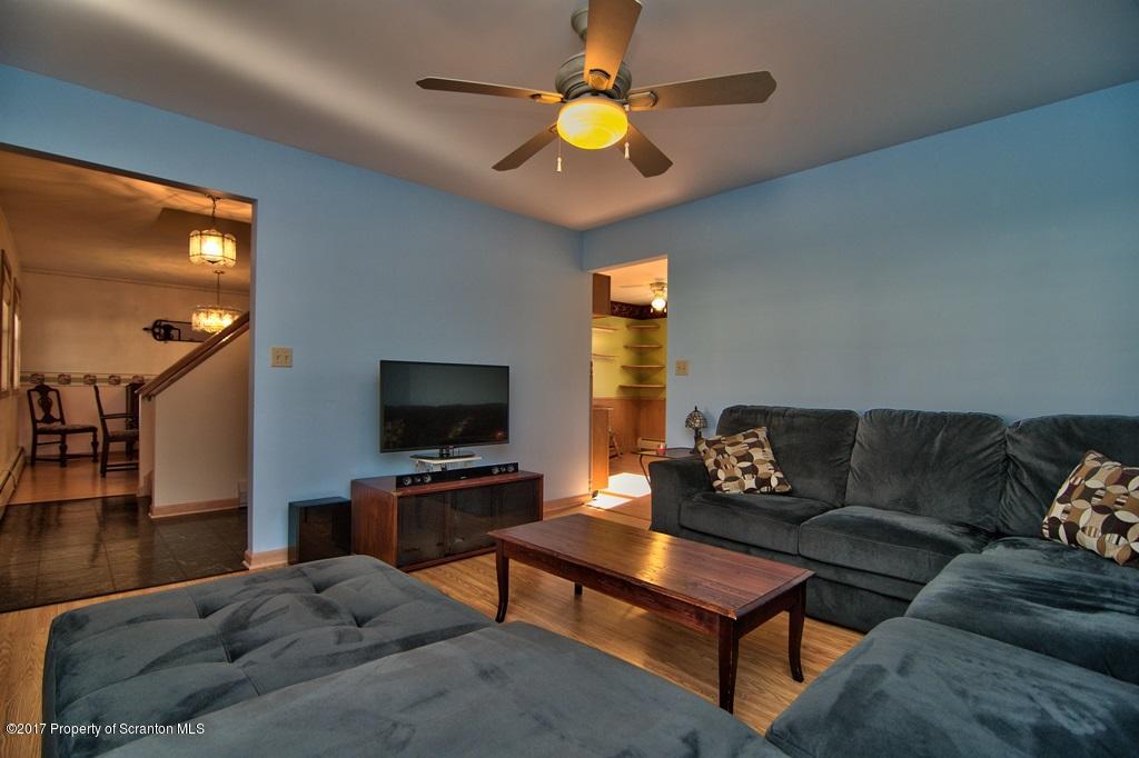 132 Thomas Road Moscow, PA 18444 - Photo 15 of 46 a living room with furniture and a flat screen tv