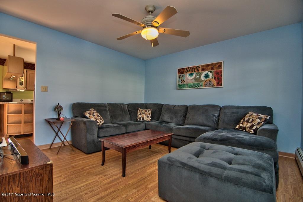 132 Thomas Road Moscow, PA 18444 - Photo 16 of 46 a living room with furniture and a wooden floor