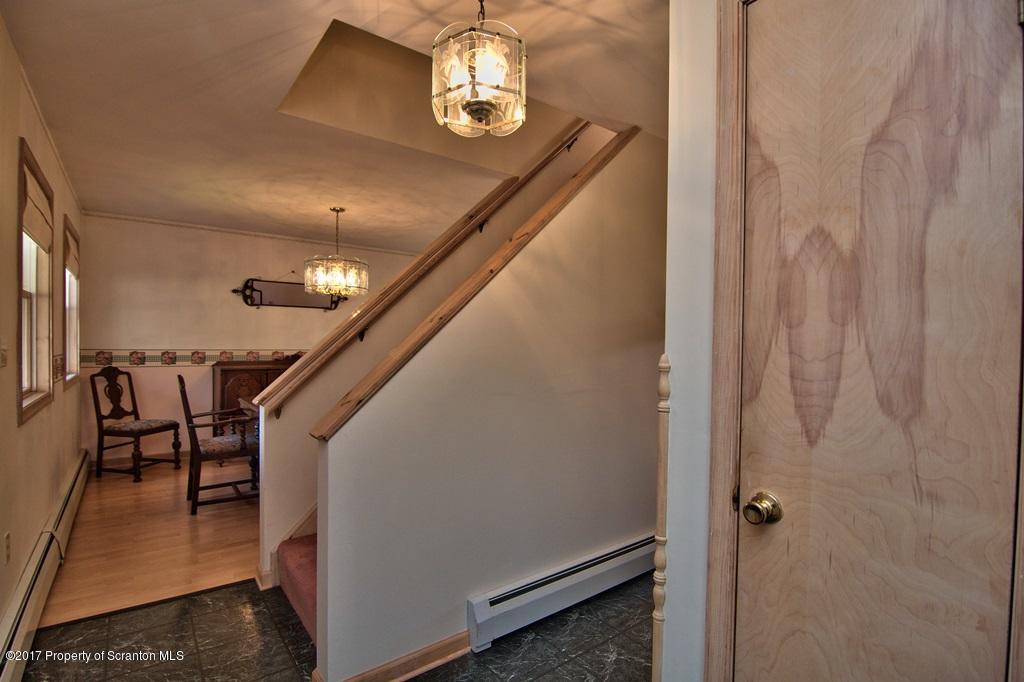132 Thomas Road Moscow, PA 18444 - Photo 17 of 46 a view of entryway and hall with wooden floor