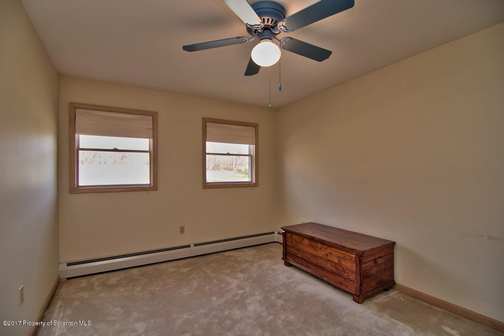 132 Thomas Road Moscow, PA 18444 - Photo 20 of 46 a room with a ceiling fan and a window