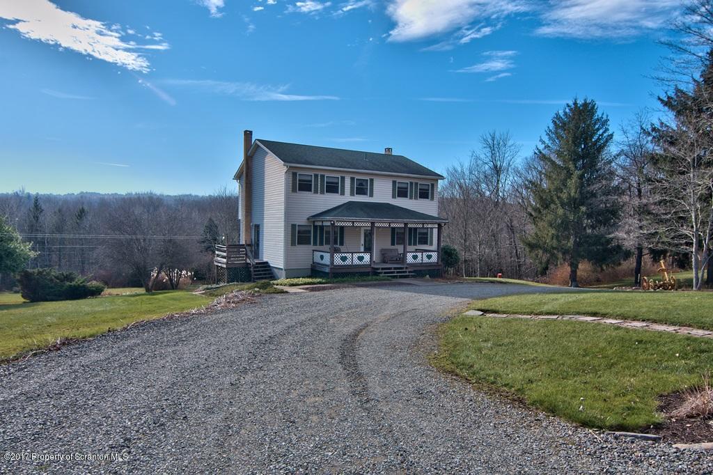 132 Thomas Road Moscow, PA 18444 - Photo 33 of 46 a front view of a house with a yard