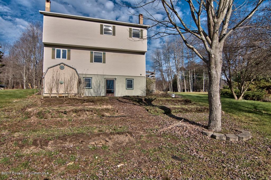 132 Thomas Road Moscow, PA 18444 - Photo 42 of 46 a front view of a house with garden