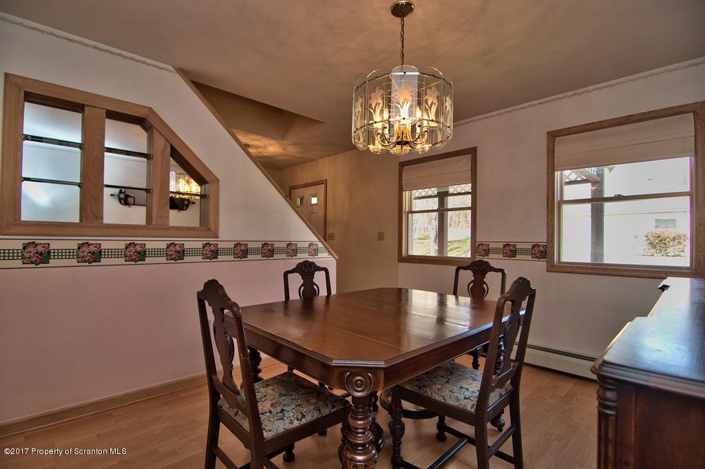 132 Thomas Road Moscow, PA 18444 - Photo 10 of 46 a view of a dining room with furniture and chandelier