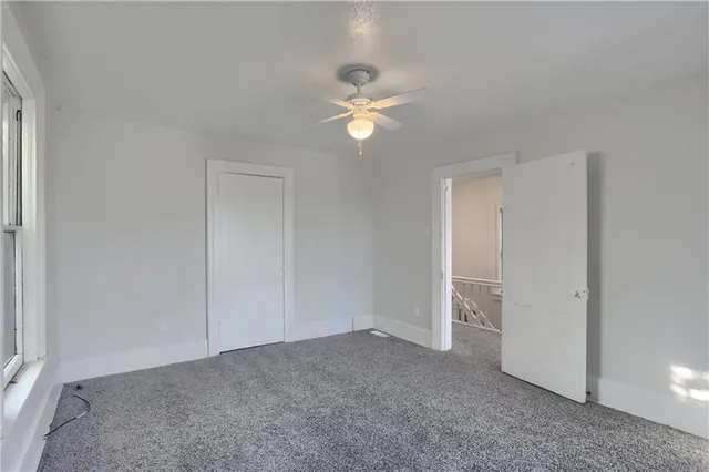 a view of empty room with fan