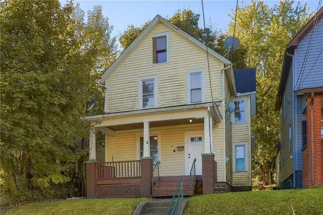 front view of a house with a yard