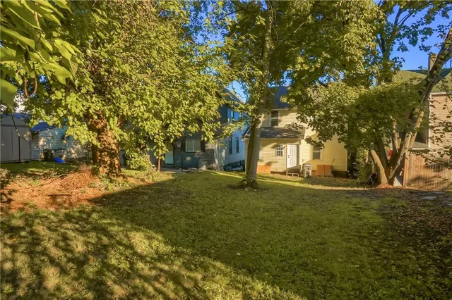 a view of a yard in front of the house