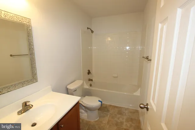 a bathroom with a tub and shower