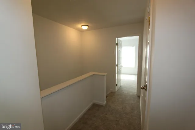 a view of hallway with an empty space