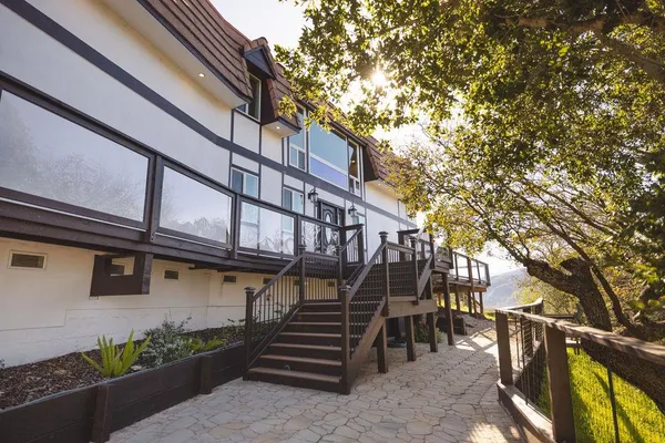 a view of a house with a tree