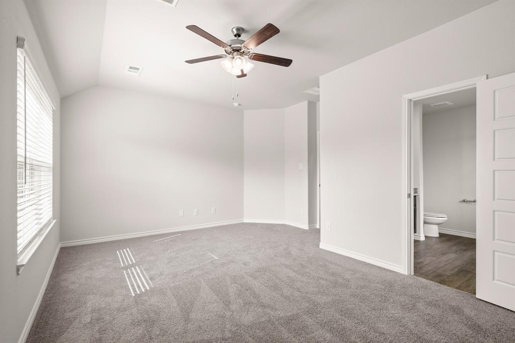 1507 Romans Road Ennis, TX 75119 - Photo 11 of 19 wooden floor in an empty room with a window