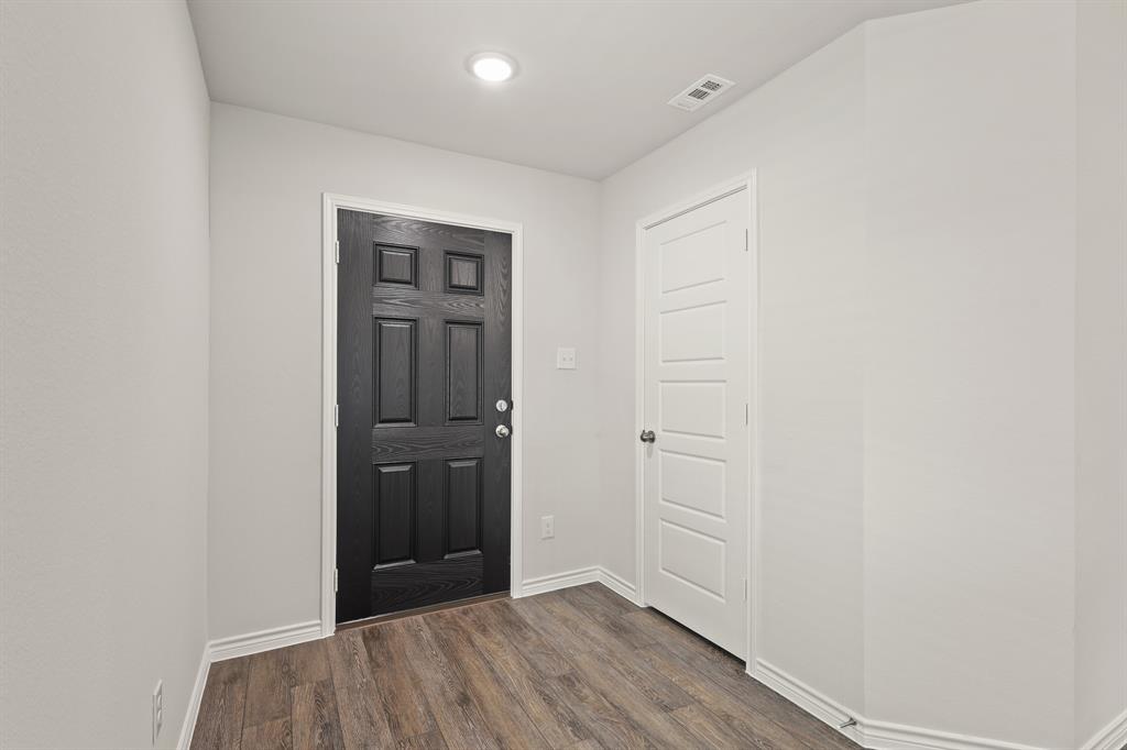 1507 Romans Road Ennis, TX 75119 - Photo 4 of 19 wooden floor in an empty room