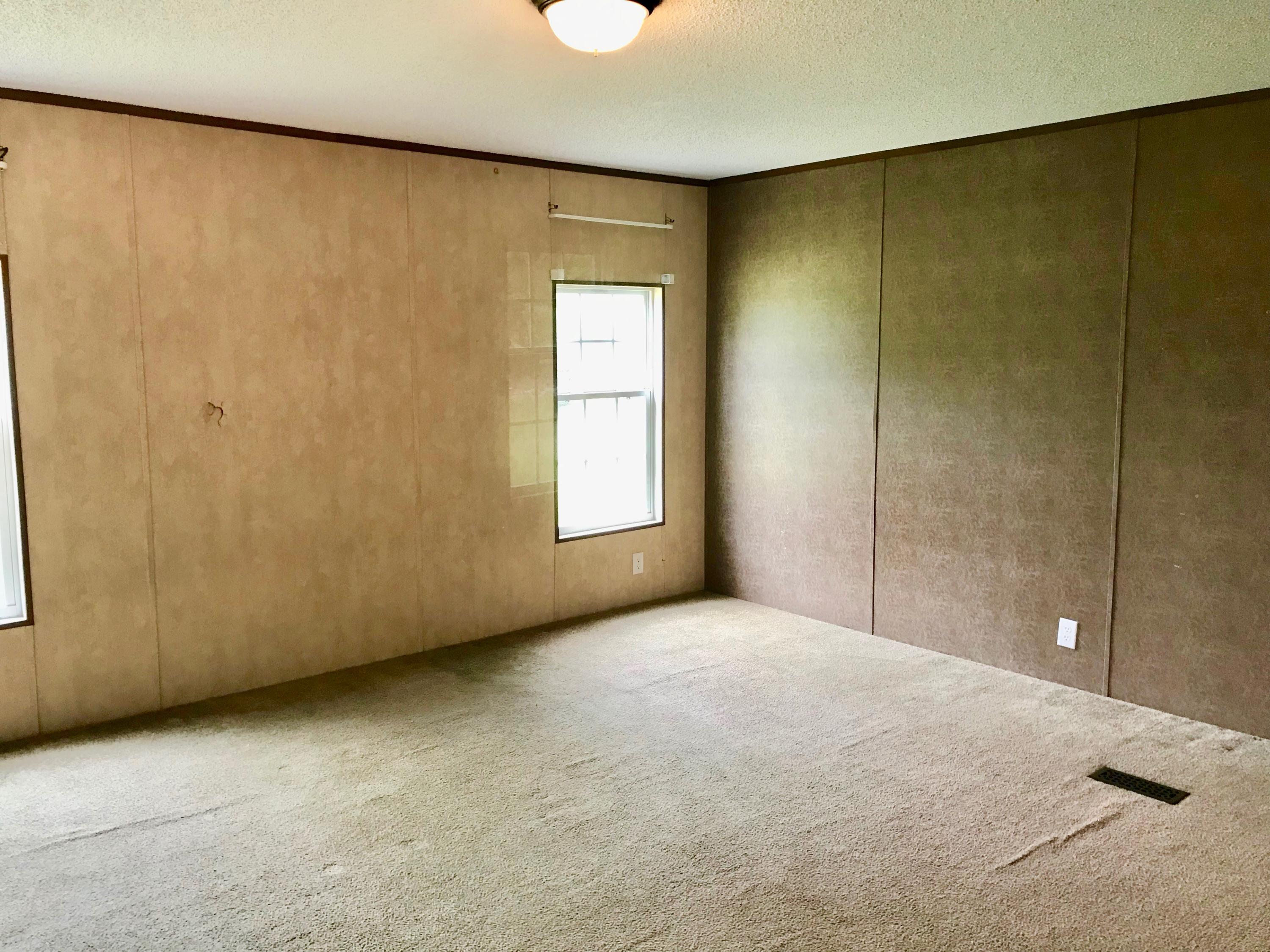 9840 American Farms Road Milton, FL 32583 - Photo 14 of 42 a view of an empty room with a window