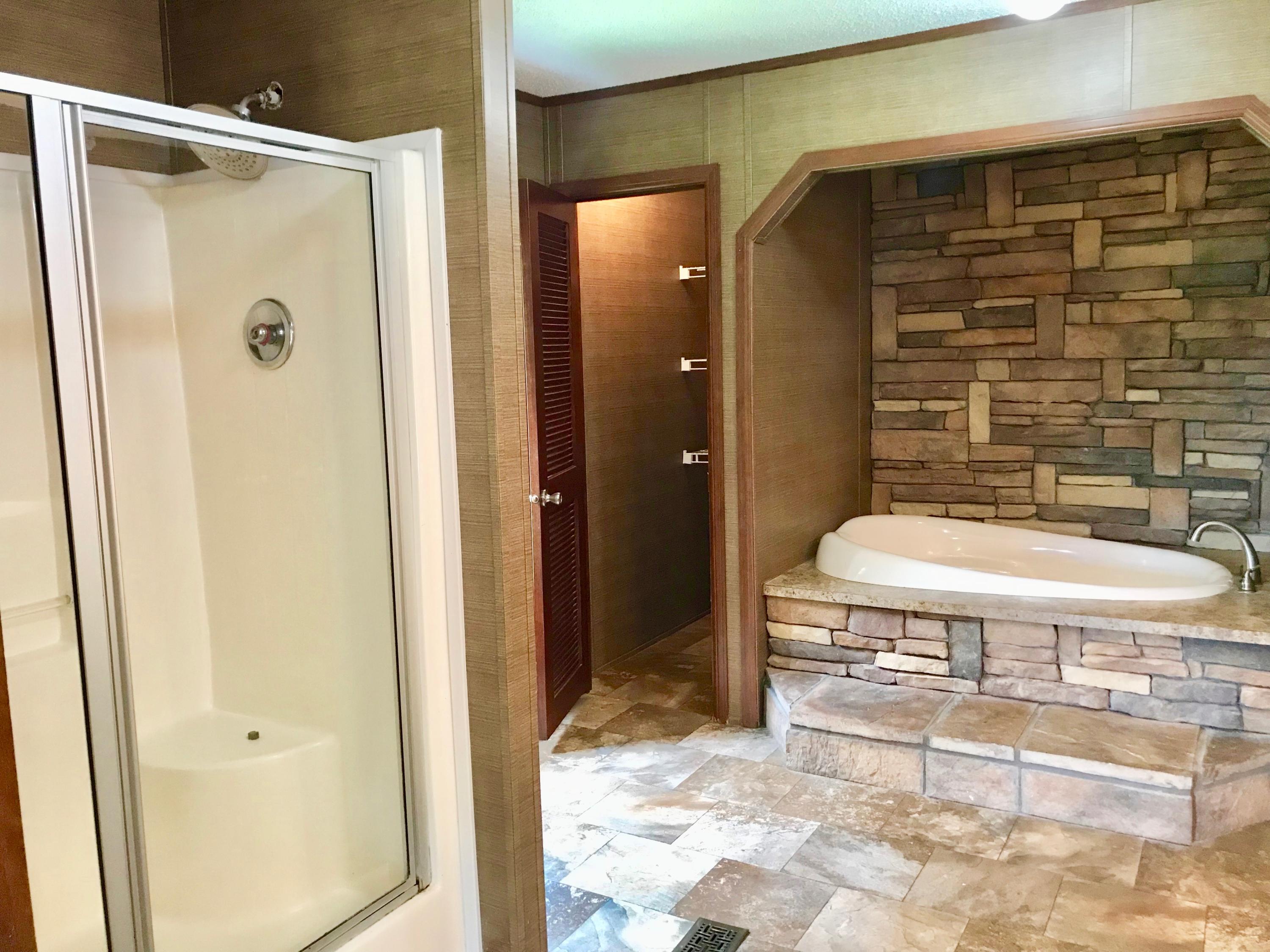 9840 American Farms Road Milton, FL 32583 - Photo 16 of 42 a bathroom with a sink and a mirror