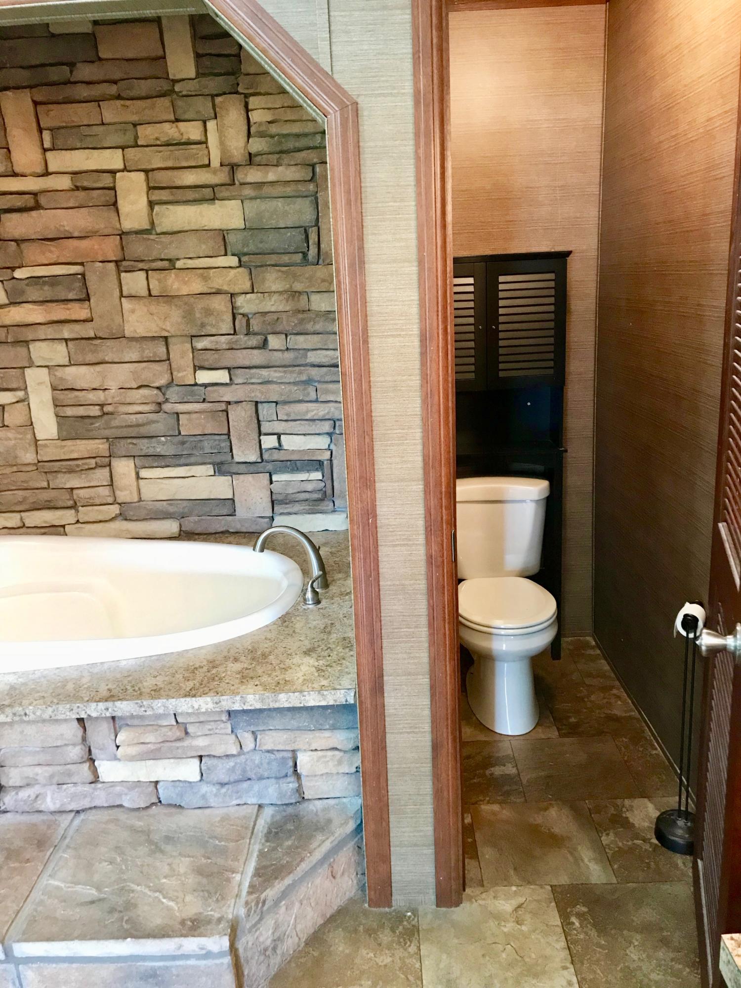 9840 American Farms Road Milton, FL 32583 - Photo 19 of 42 a bathroom with a toilet and a sink