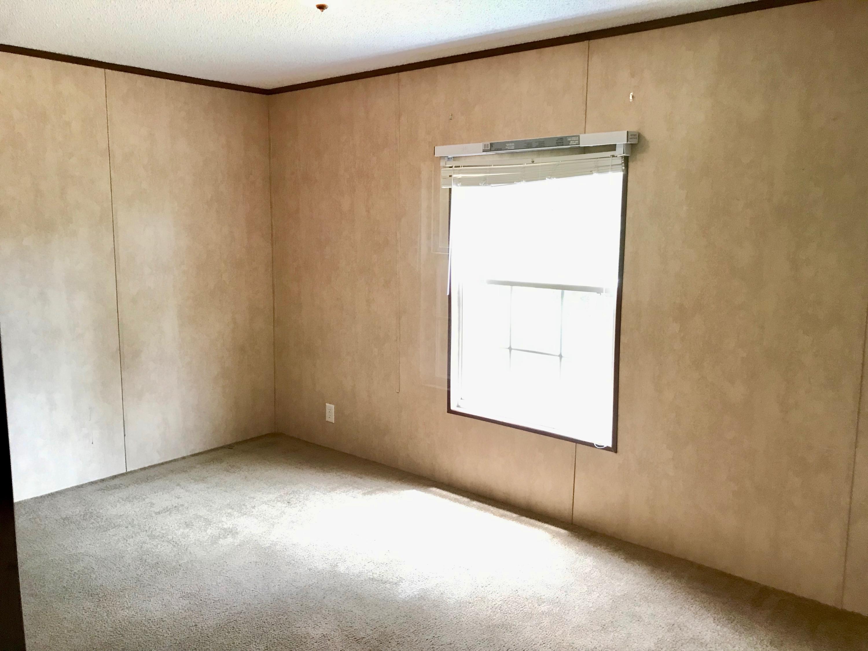 9840 American Farms Road Milton, FL 32583 - Photo 28 of 42 a view of an empty room with a window