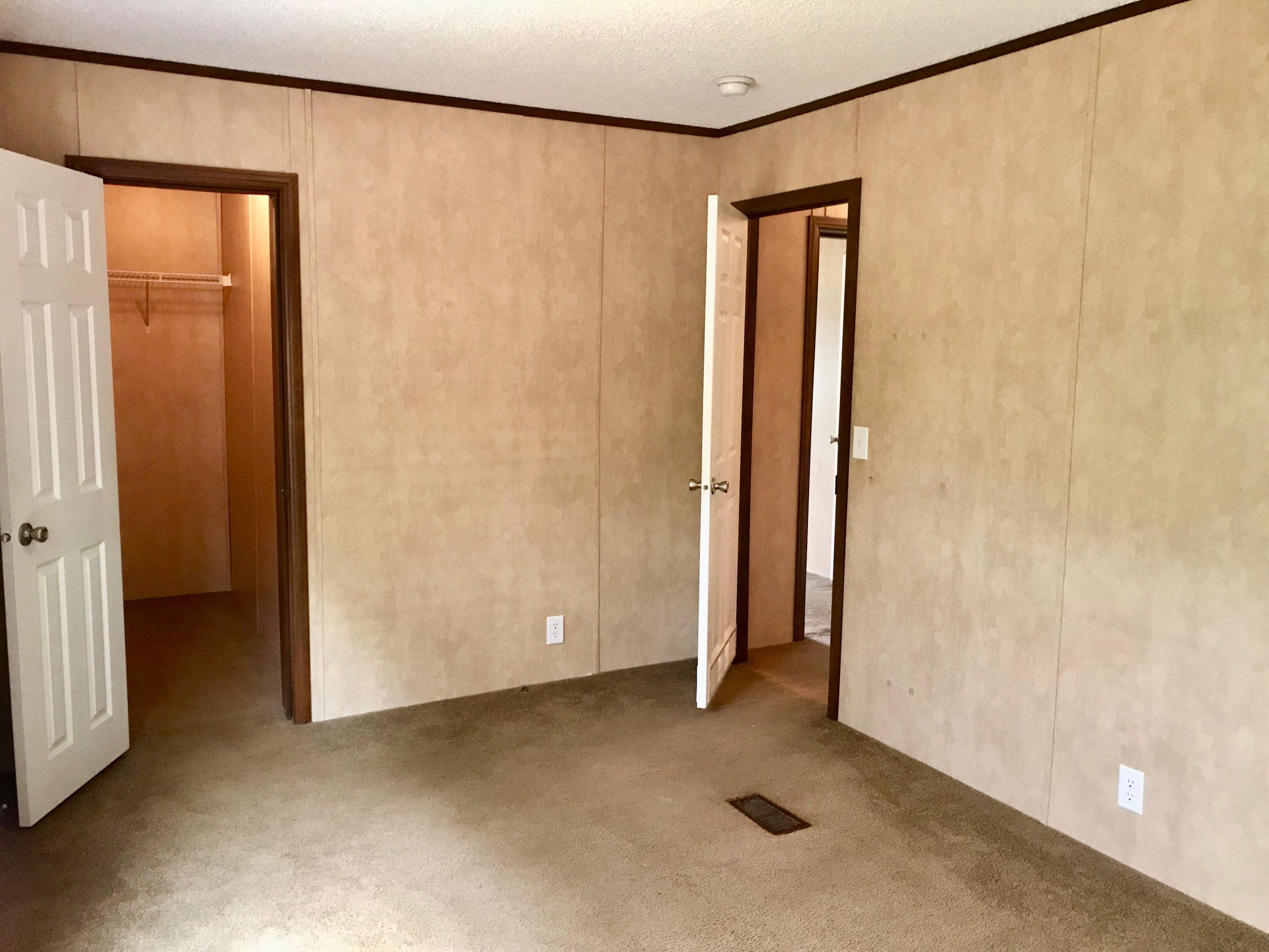 9840 American Farms Road Milton, FL 32583 - Photo 30 of 42 a view of an empty room with closet and a window