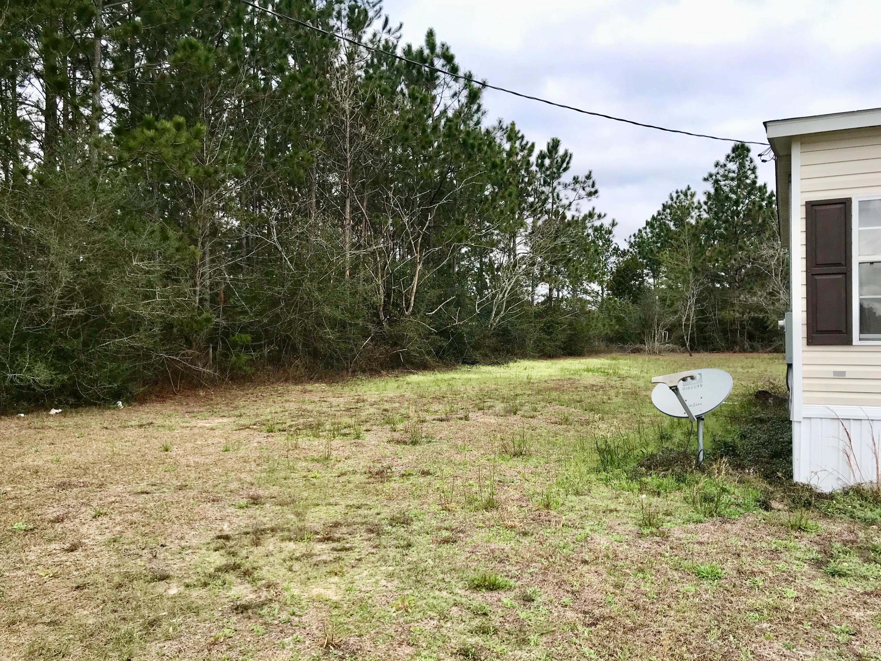9840 American Farms Road Milton, FL 32583 - Photo 40 of 42 a view of a yard