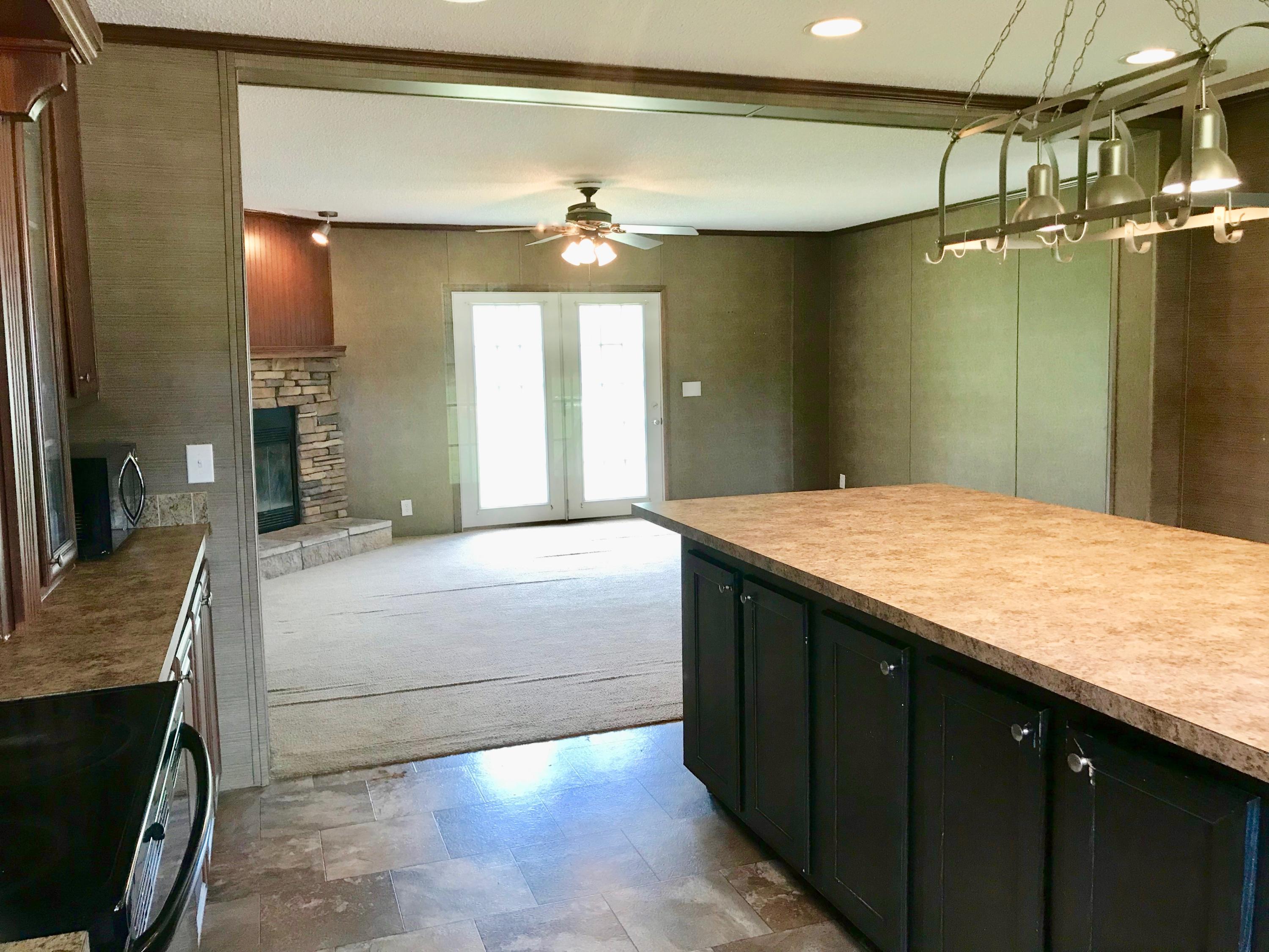9840 American Farms Road Milton, FL 32583 - Photo 5 of 42 a spacious bathroom with a granite countertop sink a toilet a mirror and shower