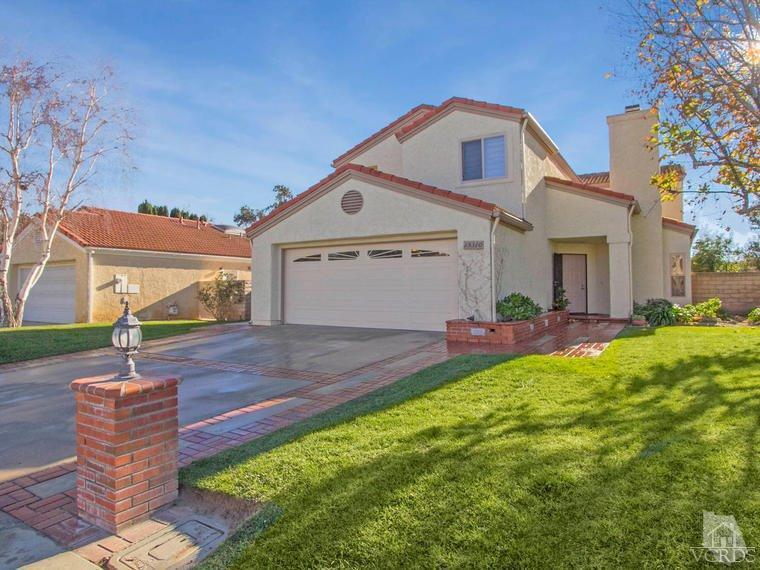 15310 Rains Court Moorpark, CA 93021 - Photo 1 of 29 a front view of a house with a yard and garage