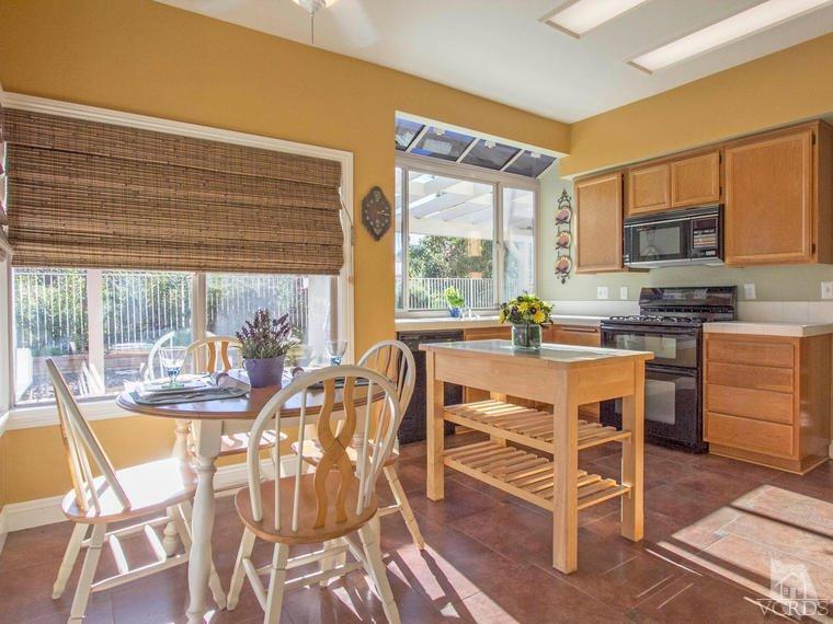 15310 Rains Court Moorpark, CA 93021 - Photo 13 of 29 a dining room with furniture and large windows