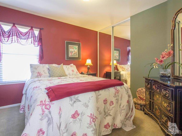 15310 Rains Court Moorpark, CA 93021 - Photo 22 of 29 a bedroom with a bed dresser and a mirror